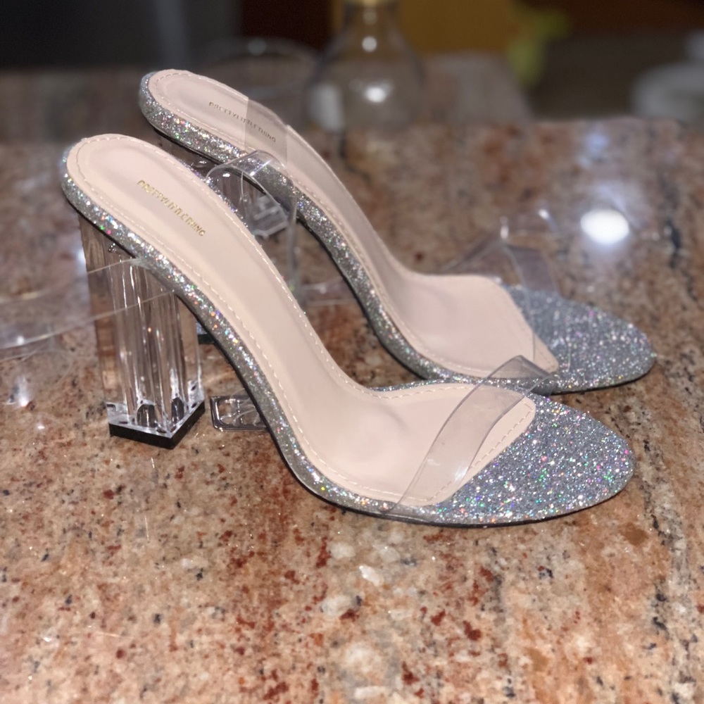 Glass , silver glitter heels .